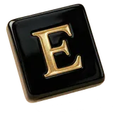 A black tile with the gold letter E