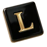 A black tile with the gold letter L