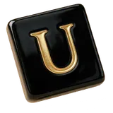 A black tile with the gold letter U